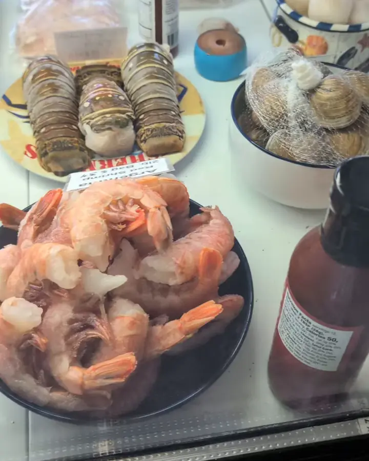 Our display case: shrimp, lobster tails, stone crab claws, sauces and smoked fish
